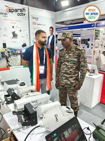 A member of the armed forces examining my rugged surveillance equipment at SES 2025. It is an honor to provide technology for those who protect our nation.
