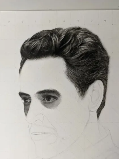 Another progress shot of the Robert Downey Jr. sketch. At this stage, I've started blocking in the dark values around the eyes, establishing the deep-set look that is crucial for capturing his likeness.