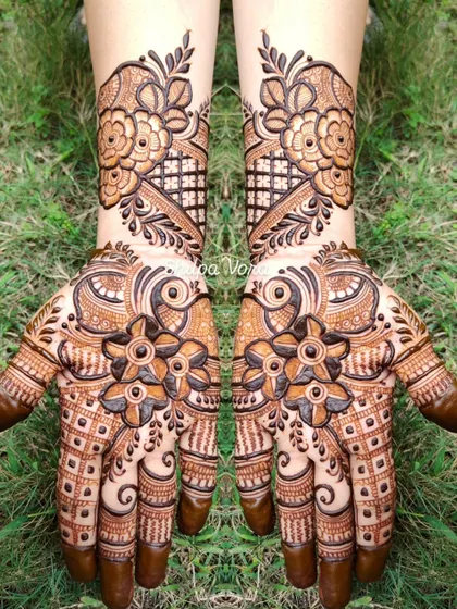A symmetrical floral design with a mix of bold and delicate flowers, creating a balanced and eye-catching look.