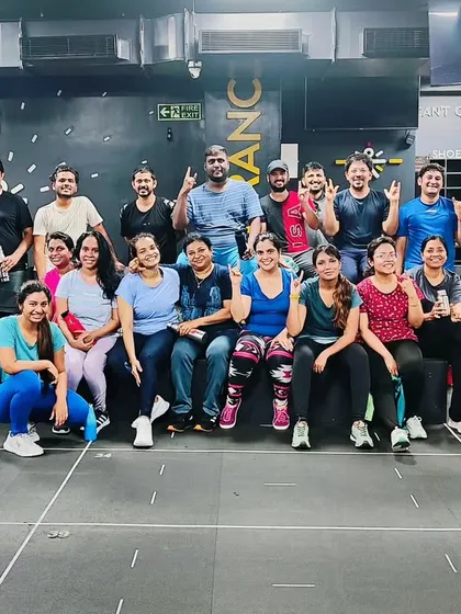 The heart and soul of my classes. Each photo captures a unique moment with my incredible community after a sweaty, joyful session. This is our shared victory lap.