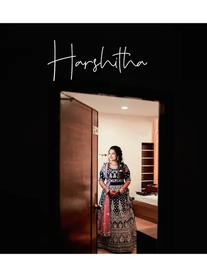 A lovely portrait of the bride, framed by a dark doorway, as she prepares to make her entrance at the reception.