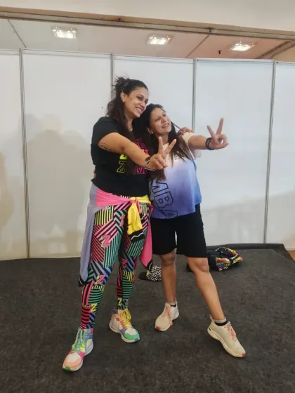 Posing with a fellow ZIN (Zumba Instructor Network) member at the FNSI expo. These events are a great opportunity to connect, learn, and grow with other fitness professionals.