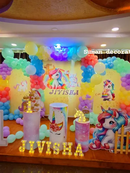 A wide shot of the unicorn party decor, highlighting the vibrant pastel colors and multiple unicorn elements used.