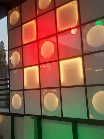 A custom-built, color-changing light panel that adds a dynamic and modern feature to the restaurant's decor.