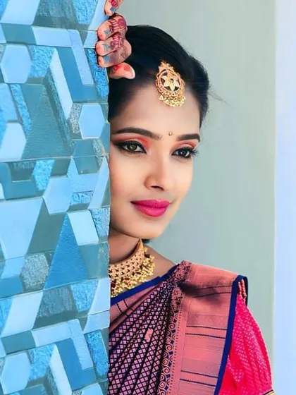 A creative shot from an engagement event. The makeup features a warm-toned eyeshadow and winged liner, designed to look striking from every angle.