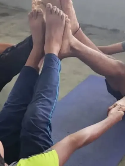 A duplicate of the three-person boat pose circle, a fun and challenging group exercise.
