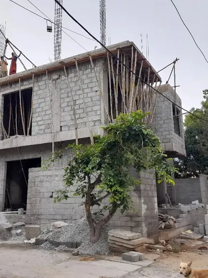 The joy of seeing a project take shape. This is the 'Nidhi Nilayam' residence under construction, with the core structure and blockwork rising, giving the first real sense of the building's form and volume on the street.