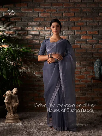 This full look showcases a grey organza saree, a perfect example of how my attire is crafted to reflect your unique expression with simplicity and grandeur.