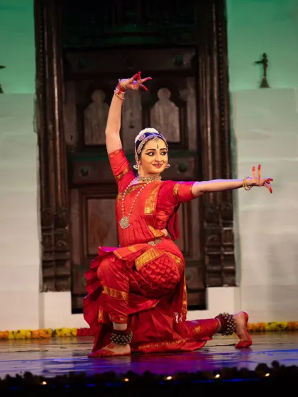 Performing at the Kalāmārga Nrityotsava in Bengaluru. The stage setting with the traditional door adds a beautiful context to the narrative of a devotee's journey.