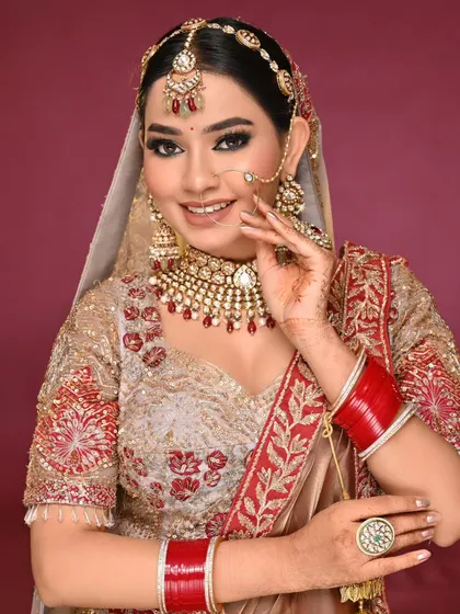 A happy, smiling bride. The makeup looks radiant and fresh, which is key for long wedding functions.