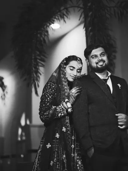 A beautiful black and white photo of the couple. This classic style adds a timeless and romantic feel to their reception portraits.