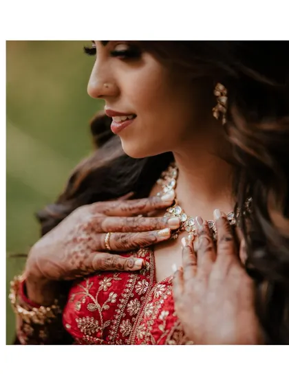 A detailed shot of the bride's hands and jewelry, a classic element of reception photography.