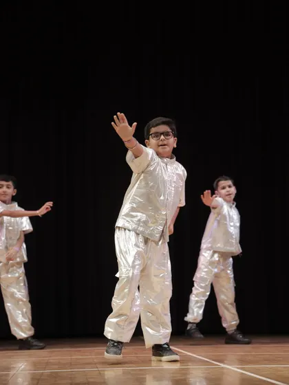 A 'Swagger Boy' reaching out to the audience. We teach our students how to connect with the crowd.