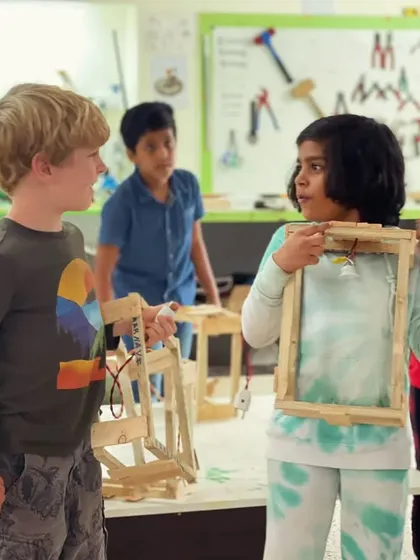 Collaboration and friendship are a big part of our workshops. Here, two new friends discuss their lantern projects, sharing ideas and learning from each other.