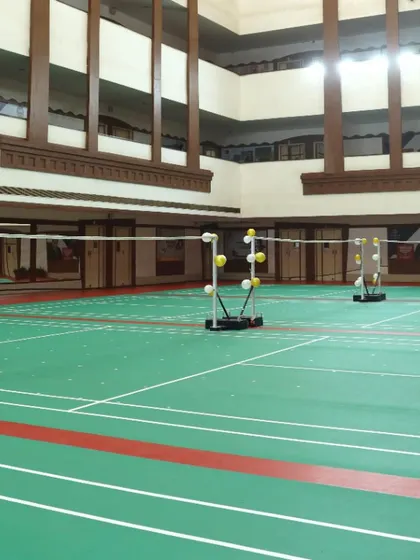 Our courts set up and ready for the opening ceremony. The shuttlecock holders show that we are equipped with professional training aids for all types of drills.