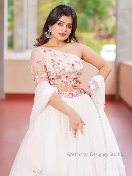 A full-length view of the model in the white floral embroidered lehenga, exuding grace and charm.