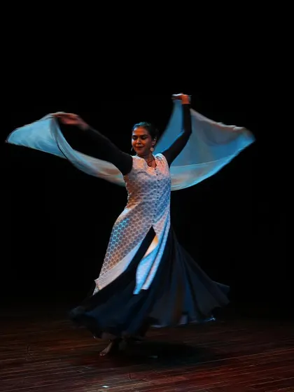 The flowing costume of a Kathak dancer adds to the beauty and dynamism of the performance.