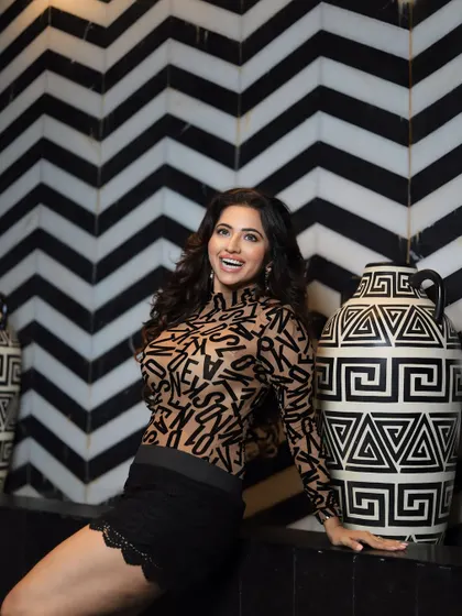 A happy, smiling shot that shows how the makeup looks natural and radiant even with a full smile.