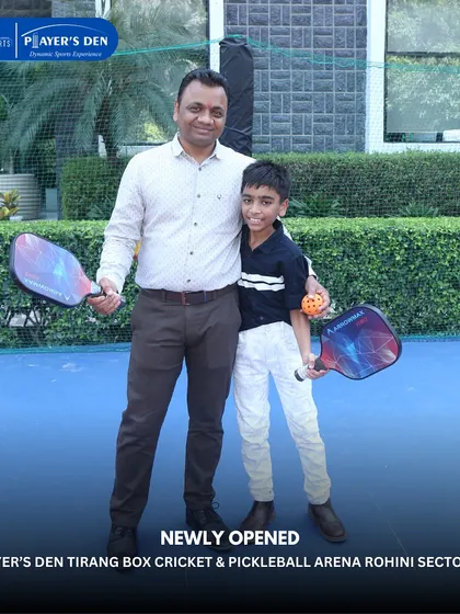 A father and son duo ready for a game of pickleball at our Rohini arena. It's a fantastic sport for families to enjoy together across different generations.