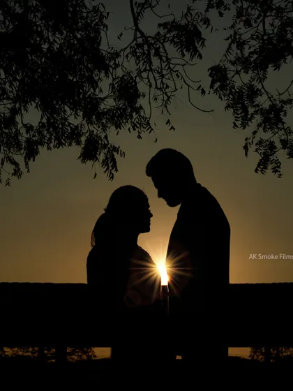 A beautiful silhouette of a couple against a golden sunset, a classic and always romantic shot.