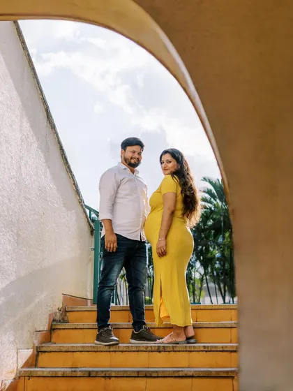 Using the strong lines of this outdoor staircase creates a unique and modern composition. The pop of her yellow dress against the sky makes for a vibrant and joyful maternity photo.