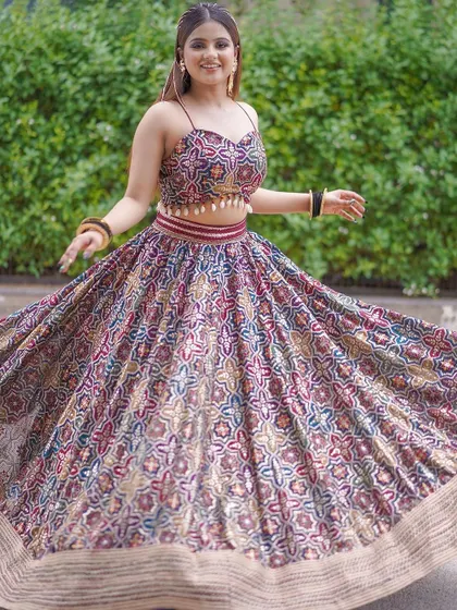 A fun, twirly shot of a multi-color printed lehenga, perfect for a Navratri event or a vibrant Mehendi party.