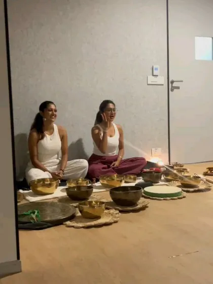 Two practitioners leading a sound bath, demonstrating the collaborative and powerful nature of these healing sessions.