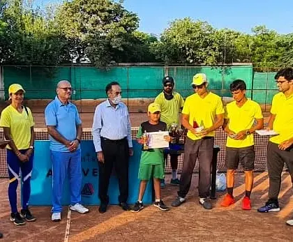 One of my U-10 players receiving his winner's certificate at our academy tournament. These events are a great way for kids to apply what they learn in coaching.