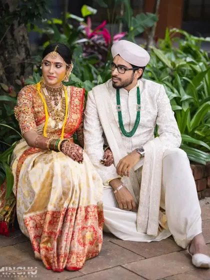 A duplicate of 309, this shot captures the couple's royal look and the bride's intricate mehndi.