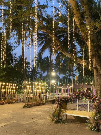 There's nothing more magical than a cocktail night under the stars. For this event, I used cascading fairy lights and warm candle-lit pathways to transform the outdoor space into an enchanting forest.