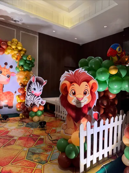 A close-up of the adorable animal cutouts, including a lion and zebra, that add character to our jungle-themed decorations.