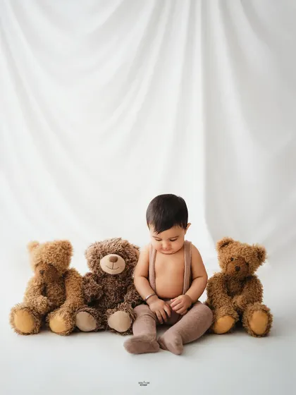 A quiet, contemplative moment from this little one's simple teddy bear session.