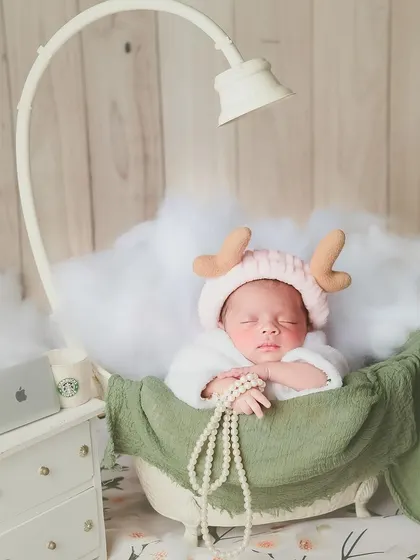 A little spa day, anyone? We create these fun and whimsical scenes, like this one with a baby relaxing in a tiny tub surrounded by fluffy clouds, to make your newborn shoot extra special.