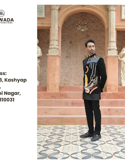 A full-length view of the abstract art bandhgala, set against a classic architectural backdrop, showing its versatility.