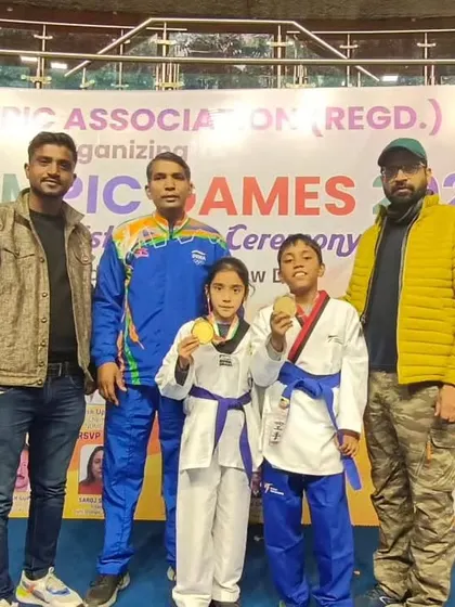 My junior champions Naysha and Rohan with their gold medals from the Delhi Olympic Games.