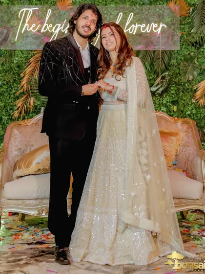 A classic portrait of the newly engaged couple, capturing their joy and the beautiful decor.