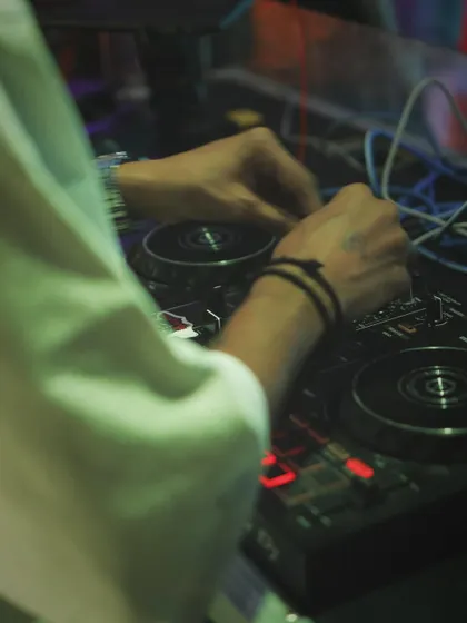 A close-up of my hands working the mixer in Ahmedabad. It's all in the details when you're crafting a set for a high-energy crowd.