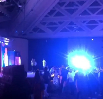 A bright flash of light energizes the crowd at the Sheraton Grand ballroom.