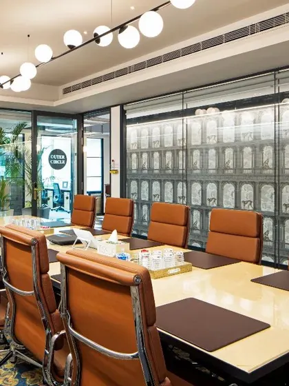 The conference room at the Okhla office, featuring bold carpeting and custom wall graphics. This space is designed to be a hub of creativity, with vibrant colors and unique details that stimulate discussion and innovation.
