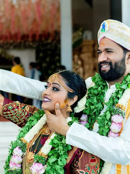 A playful and modern twist on a wedding portrait, with the couple taking a selfie together.