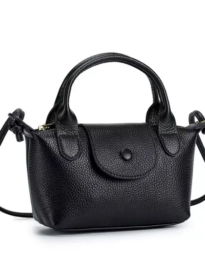 A clean product shot of the Metro Mini in black. This is a timeless and essential piece that you'll use for years.