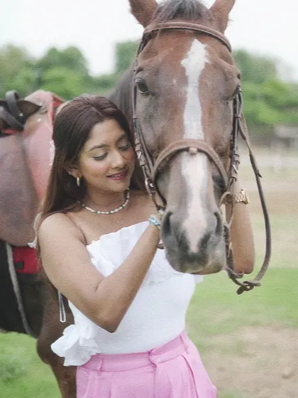 A quiet moment of connection between a rider and her horse. These interactions are just as important as the ride itself.