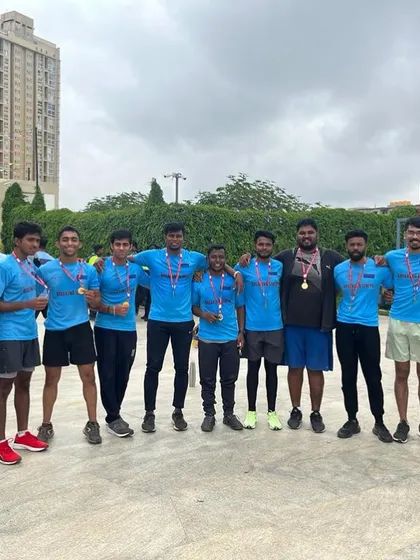 Another proud team photo with our medals after the charity run. Every finisher's medal represents a personal victory and a shared team achievement.