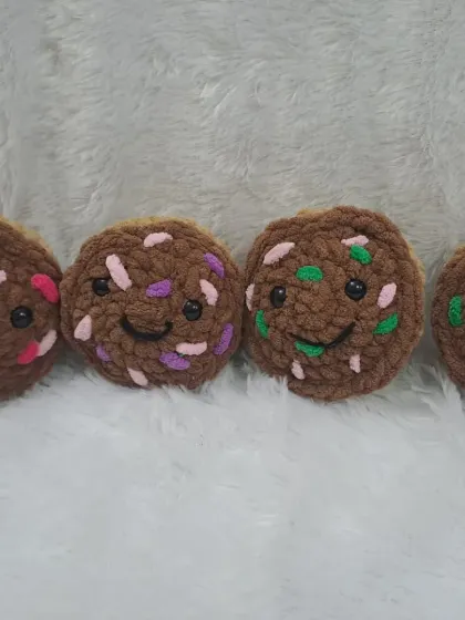 For chocolate lovers, I make these brown cupcake plushies. Each one has a happy, smiling face.