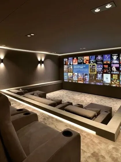 This modern design features a unique sunken seating area surrounded by LED strip lighting. It creates a cozy, conversation-pit feel while still being optimized for a cinematic experience.