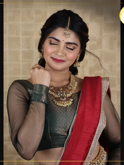 A soft and dreamy bridal portrait. With eyes closed, you can appreciate the delicate blending of the eyeshadow and the subtle glow on the high points of her face. This is a look of pure elegance.