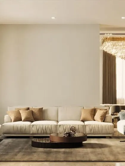 Natural light is one of my favorite design elements. This spacious living room is designed to feel bright and airy, with large windows, light-colored sofas, and a magnificent crystal chandelier that sparkles day and night.