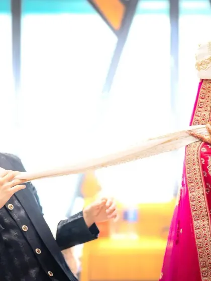 Bringing the fun to wedding portraits. This couple's playful vibe was amazing, and the heart-shaped glasses were the perfect touch for their fun-filled Indian wedding photoshoot.