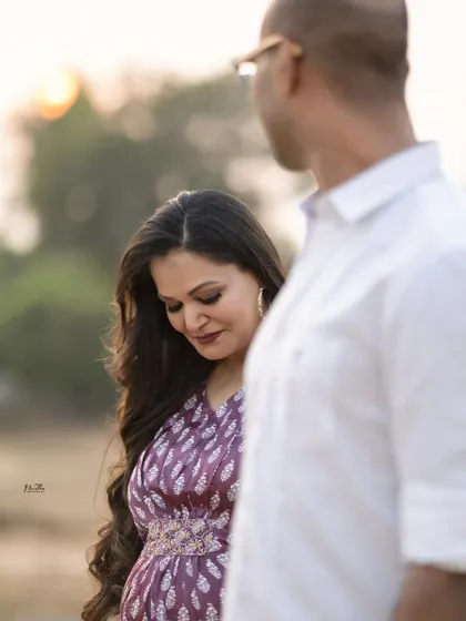 A candid moment from our maternity photoshoot, filled with love and happiness.
