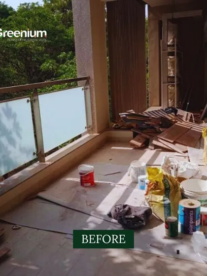 The "before" shot of a balcony garden transformation. This image shows the cluttered and unused space before my team and I turned it into a lush, green retreat.